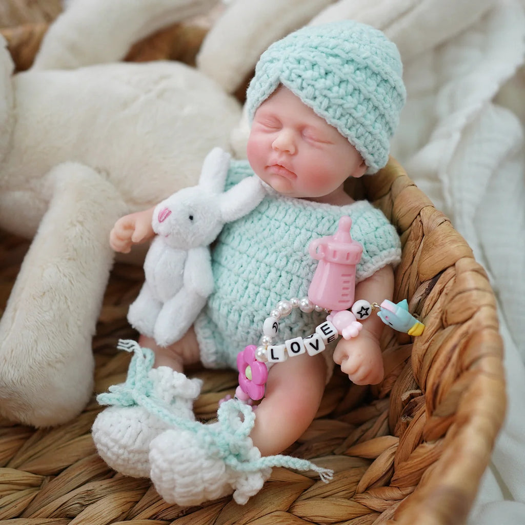 Boneca Bebê Reborn Brastoy Realista Silicone 20cm Conjunto de Roupa Mamadeira e Pelúcia Pode Dar Banho Roupa