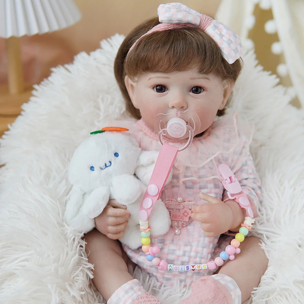 Boneca Bebê Reborn Brastoy Realista Silicone 48cm Conjunto de Roupa Chupeta Mamadeira e Pelúcia Pode Dar Banho Roupa