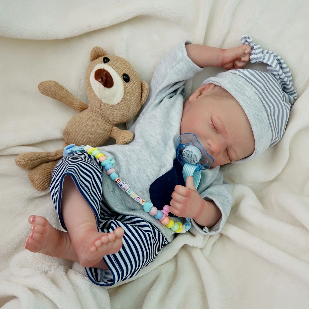 Boneco Bebê Reborn Brastoy Realista Silicone 48cm Conjunto de Roupa Chupeta Mamadeira e Pelúcia Pode Dar Banho Roupa