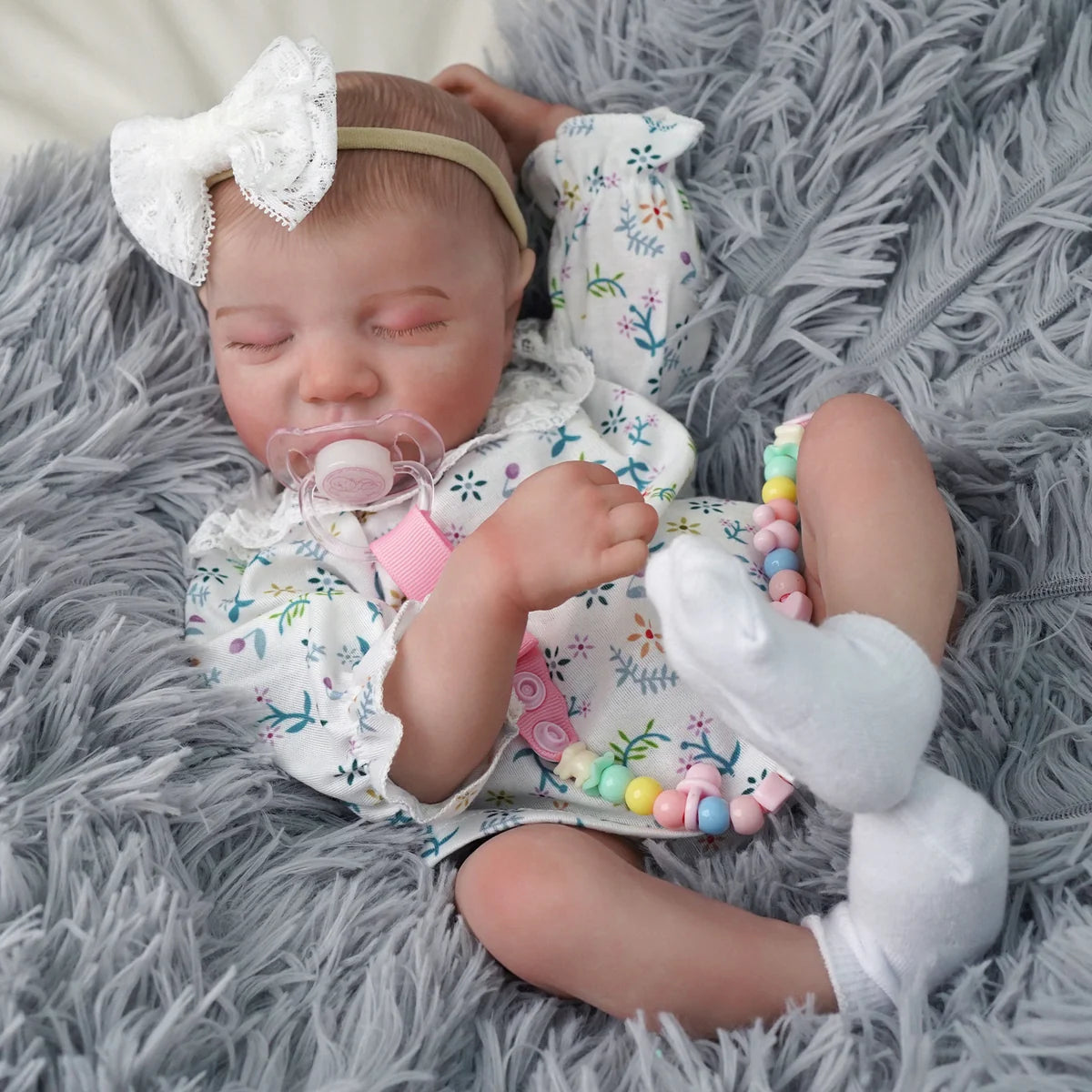 Boneca Bebê Reborn Brastoy Realista Silicone 48cm Conjunto de Roupa Chupeta Mamadeira e Pelúcia Pode Dar Banho Roupa