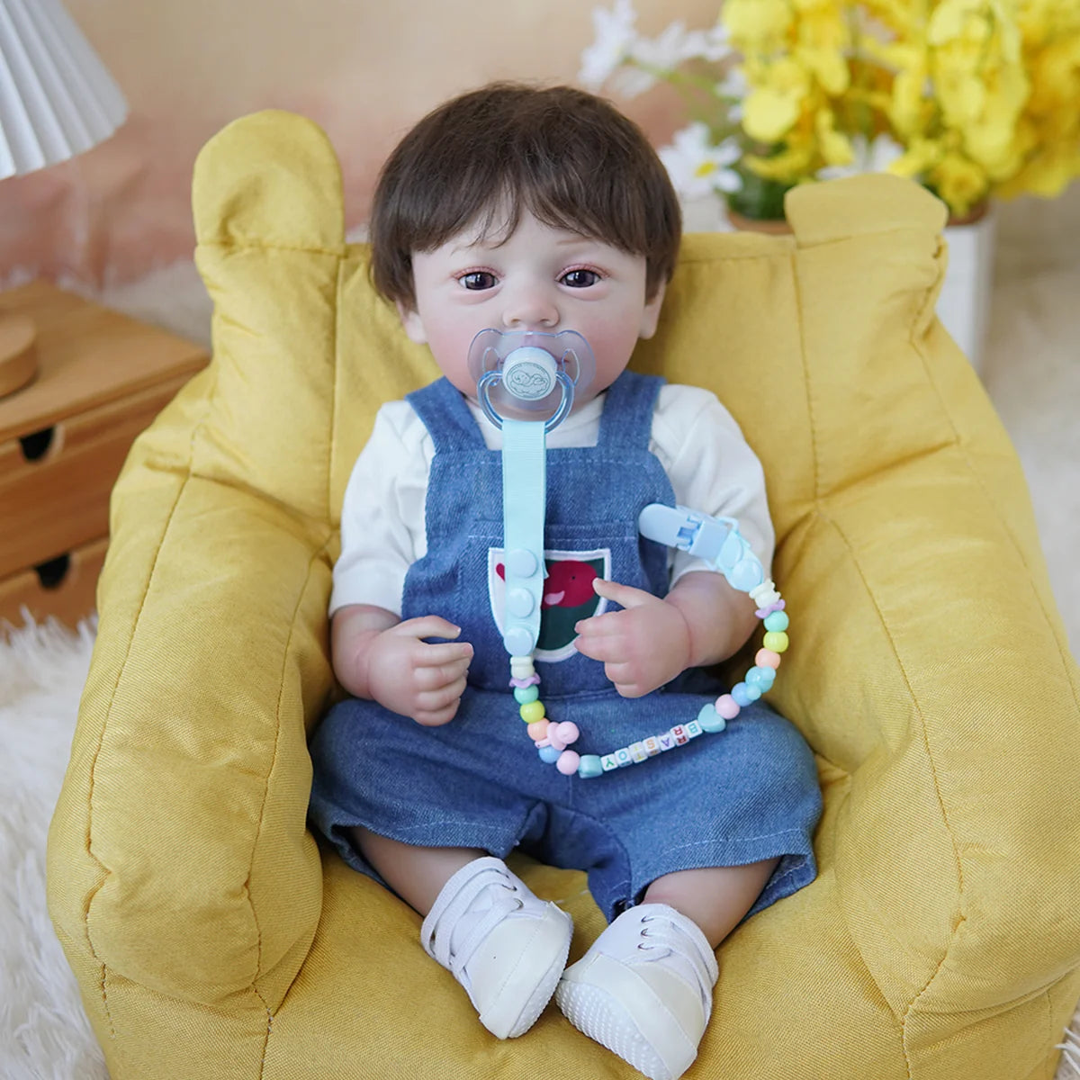 Boneco Bebê Reborn Brastoy Realista Silicone 48cm Conjunto de Roupa Chupeta Mamadeira e Pelúcia Pode Dar Banho Roupa