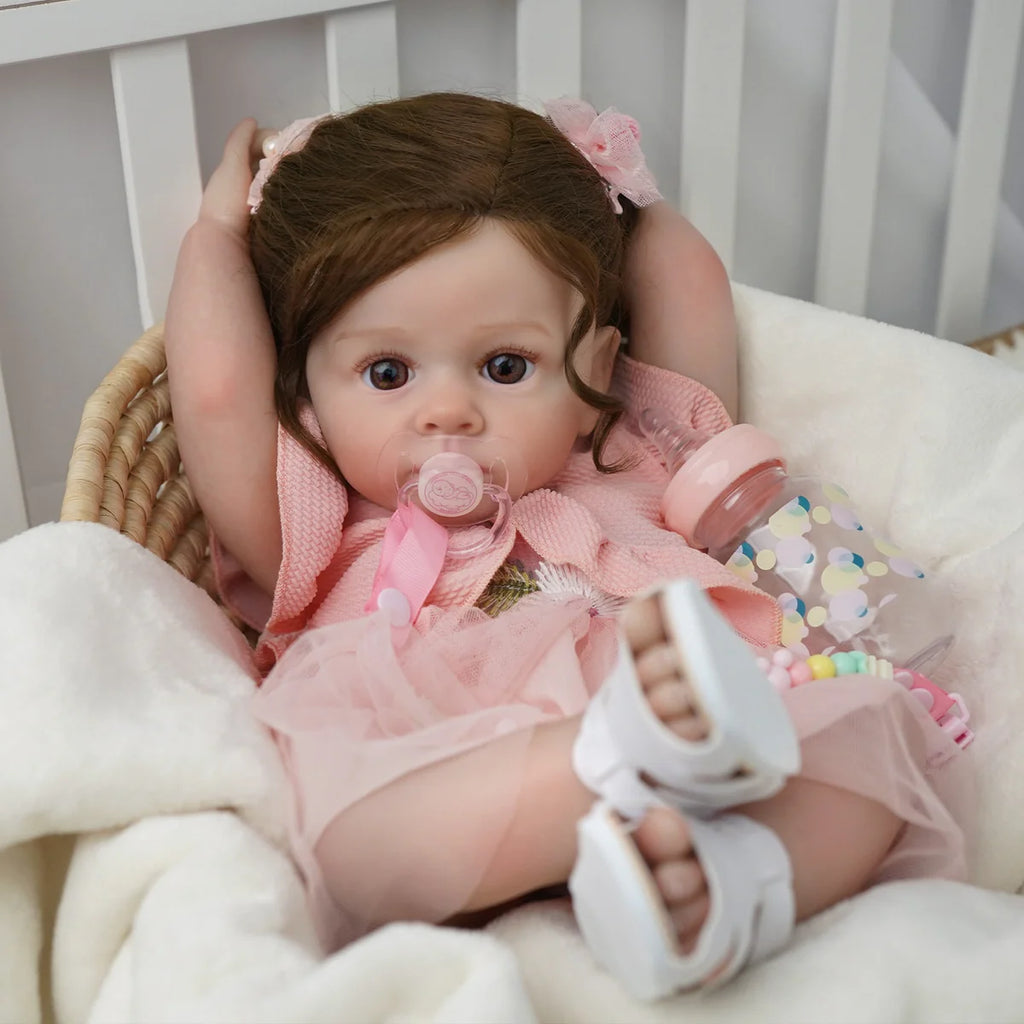 Boneca Bebê Reborn Silicone 55cm Menina Olho Castanho Vestido rosa com Acessórios Brastoy