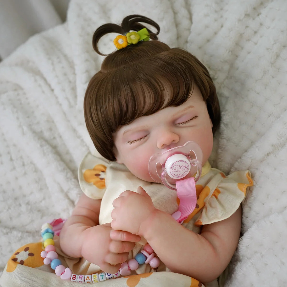 Boneca Bebê Reborn Silicone 48cm Menina Olho fechado Pode dar Banho com Acessórios Brastoy