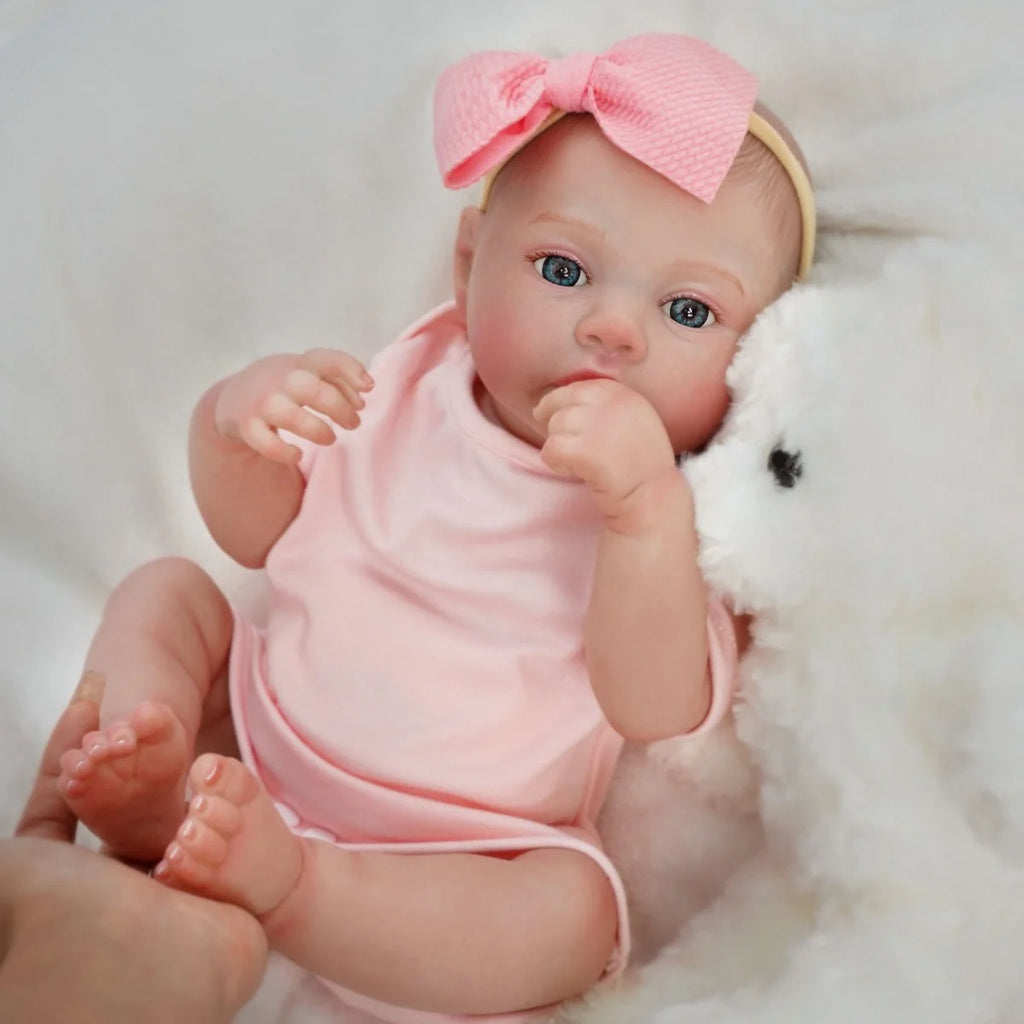 Boneca Bebê Reborn Realista Brastoy Silicone Kit Conjunto de Roupa Chupeta Mamadeira e Pelúcia Menina